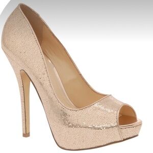 Shimmery gold peep-toe pumps.